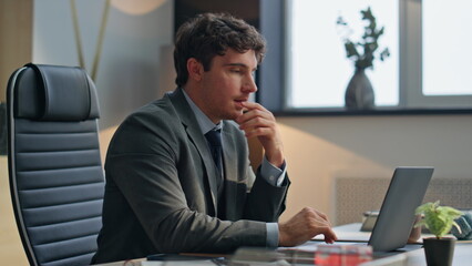 Office man typing keyboard closing laptop lid at buro closeup. Happy guy resting