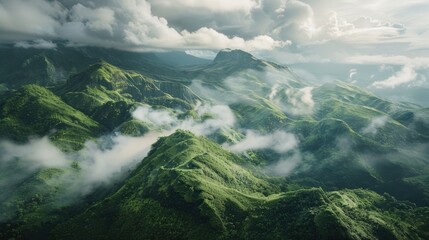 A scenic view of a mountain range with fluffy clouds in the sky, great for use as a background image or landscape photo