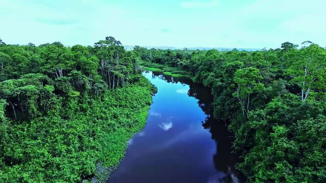 Drone flying in the clouds over the river in Amap&aacute;, Amazon Brazil