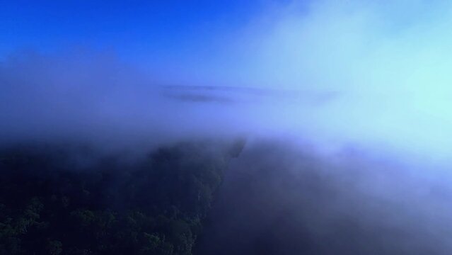 Drone flying in the clouds over the river in Amap&aacute;, Amazon Brazil