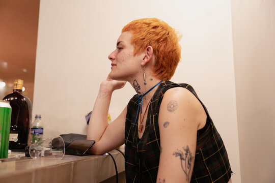 Trendy Ginger Woman With a Pixie Cut