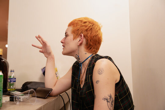Woman With Orange Pixie Cut