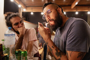 Alternative Man Lighting a Weed Cigarrette