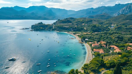 Obraz premium An aerial view showcasing a Mediterranean Sea bay featuring mountains, a sandy beach, and boats on a sunny day during summer. Generative AI