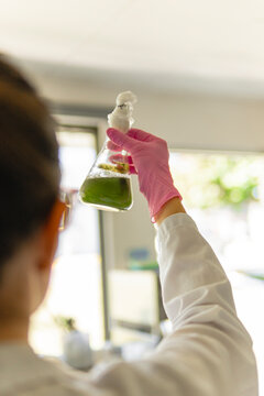 Crop chemist measuring a chemical product 