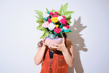 Woman showing her crochet creation