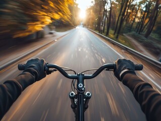 Naklejka premium A person riding a bike down a road