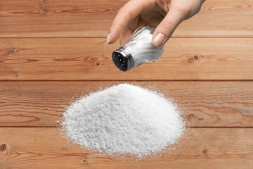 White Salt pile on a wooden table