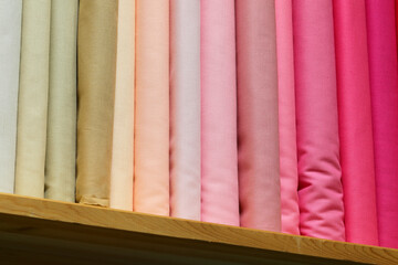 array of cotton fabric scraps and remnants in a traditional tailor shop for creating bespoke...