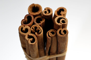 group of cinnamon pods tied on bench background