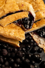 a bun and freshly frozen blueberries harvested in the forest