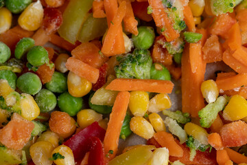 a mixture of quick-frozen corn, peas, peppers, and carrots