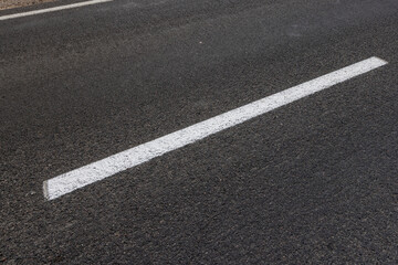Fototapeta premium details of road markings on the road for traffic control