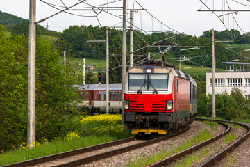 A passenger train traveling on an electrified railway, in Slovakia.

