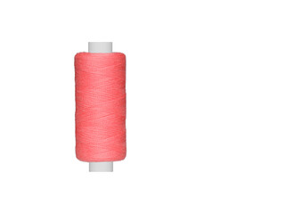 pink spool of sewing thread isolated on white background close up