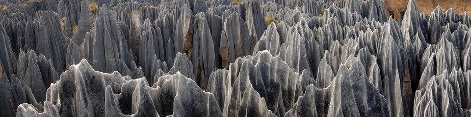 Rough textured cliffs, eroded limestone formations, scenic landscape.