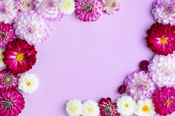 Summer flower frame made of multicolored dahlias in purple white and red shades. Flat lay, copy space. Summer concept © Katya Slavashevich