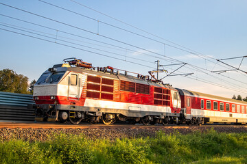 Naklejka premium A passenger train traveling on an electrified railway, in Slovakia.