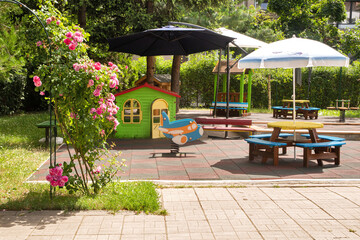 Playground equipment in kindergarten on sunny day
