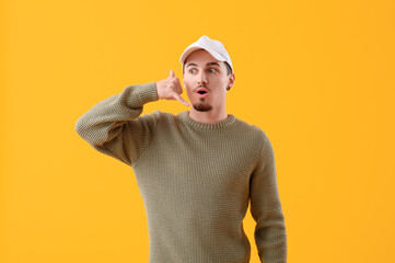 Surprised young man showing 