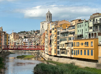 View of the old town and eiffel bridge on a summer day. Girona. Spain.