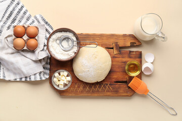 Wooden board with different ingredients for preparing bakery on color background