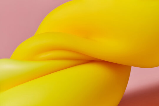 Yellow plasticine folded in several layers and located in pink studio