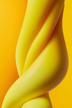Creative pattern of twisted yellow toy slime in studio