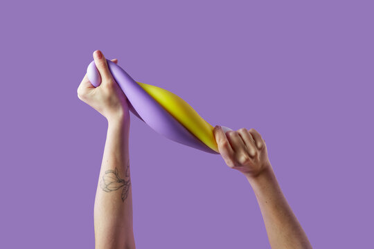 Unknown person twisting into spring two bright anti stress