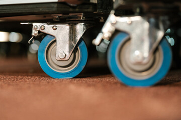 Caster roller wheels supported with metal handle