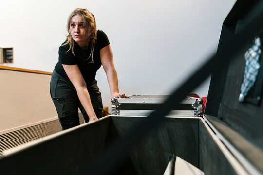 Sound engineer with road cases in backstage