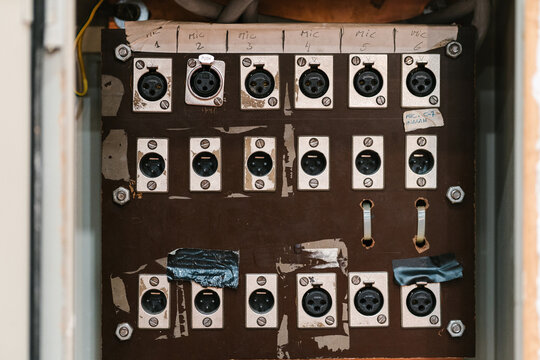 Audio stage box mounted on wall at music concert