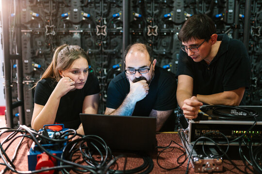 Group of colleagues working with a laptop