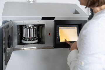 Close Up Of Scientist Using Fading Lamp Tester