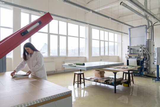 Scientist Using Vacuum Membrane Press Machine