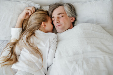 Father and daughter sleeping peacefully