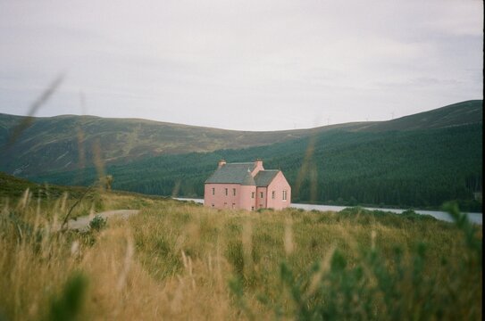 A pink cottage house on Loch Glass, Scotland, 35mm film.