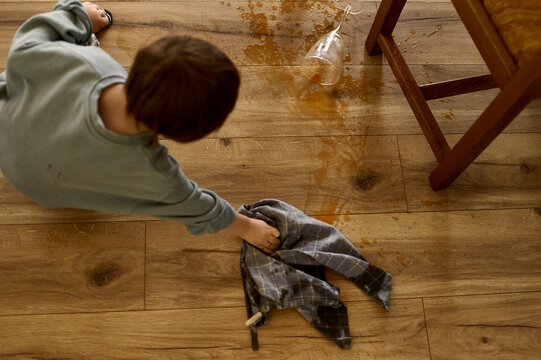 a dad has a fun with his son in a kitchen