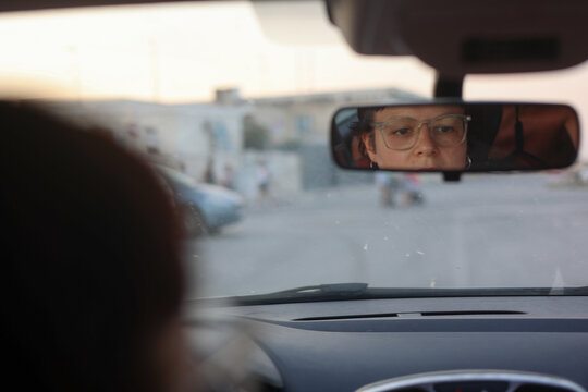Z generation girl driving in town