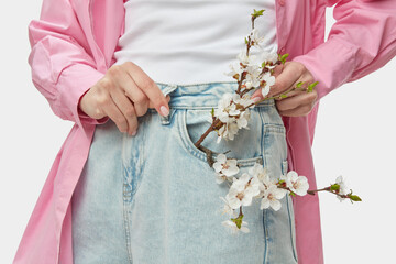 Woman wearing jeans and focusing attention on strength of belt loops