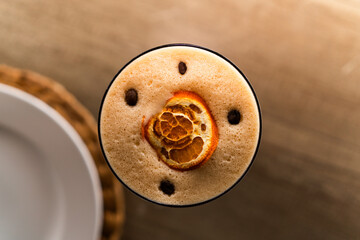 Artisanal coffee with orange garnish