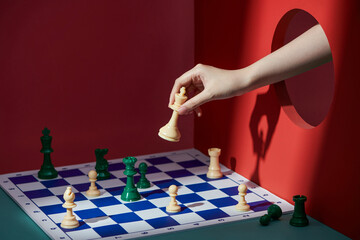 closeup hand playing chess moving chesspiece step forward