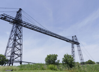 Rochefort Transporter Bridge with its high pylons of steel and iron seen from the bank of the...