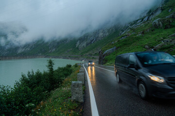 Traffic on mountain road during the rain