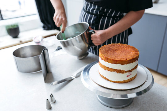 Cake Assembly in Modern Kitchen