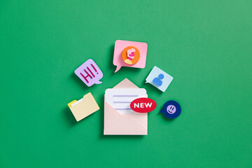 mail envelope with floating red marker, message box and emoticon