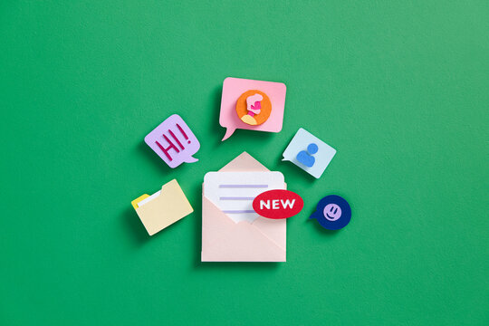 mail envelope with floating red marker, message box and emoticon