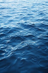 Naklejka premium Calm Blue Ocean Water Ripples on a Sunny Day