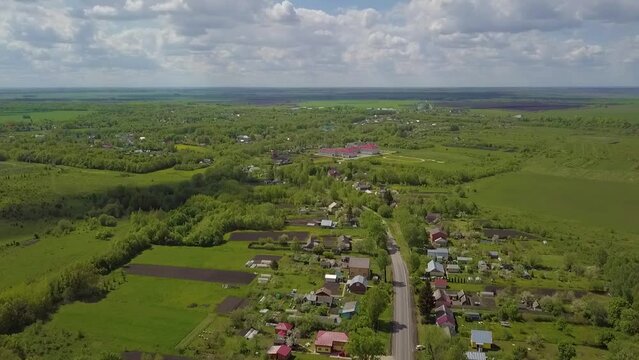 Aerial View of a picturesque Countryside with lush Green Fields and scattered Houses