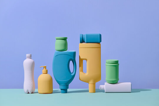 Still life of different types of plastic packaging on pastel